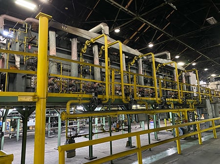 Large industrial furnace with yellow tubes